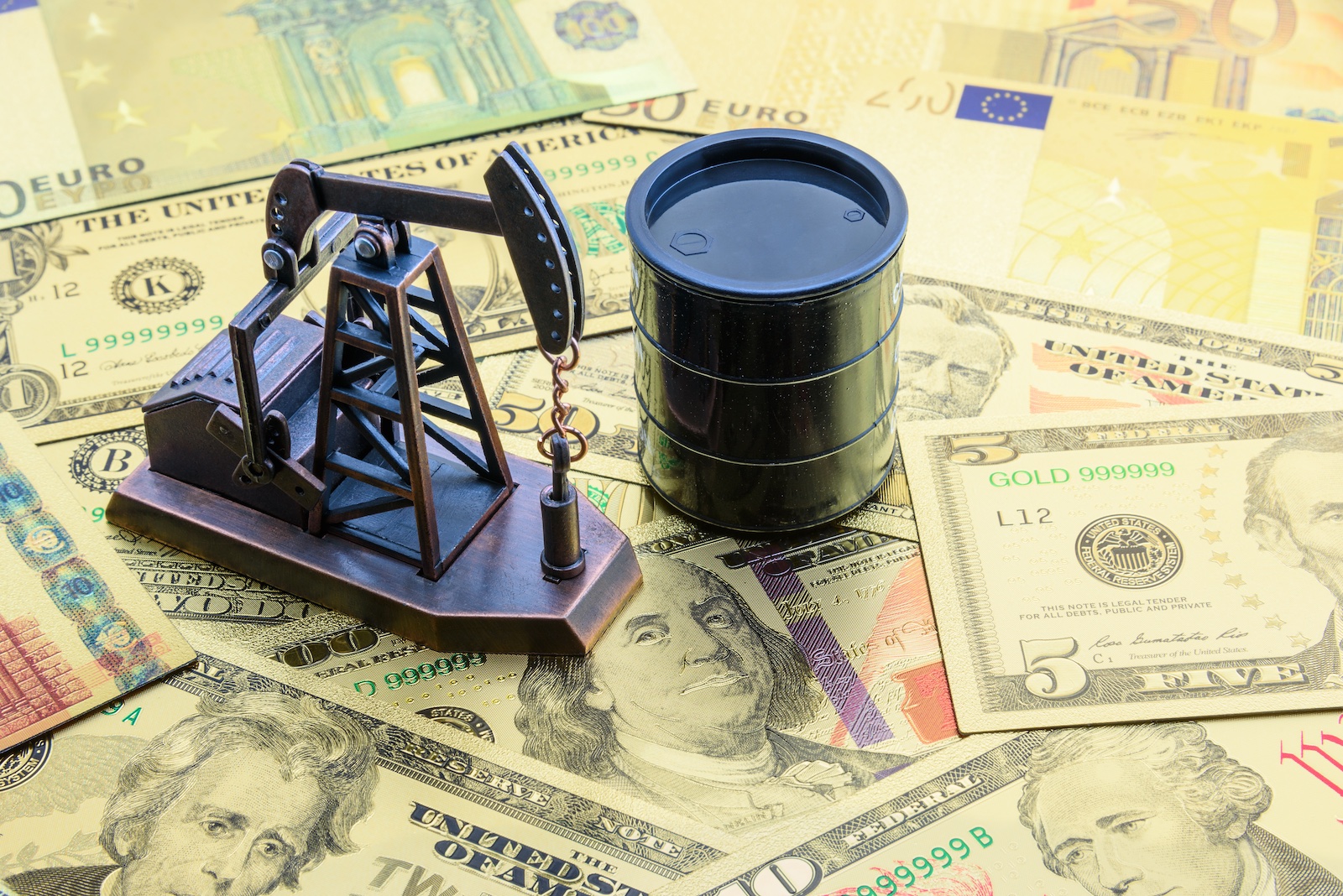 Anti-money laundering AML Compliance: Image shows US dollars, an oil rig, and an oil barrel. Money laundering with Mexican heavy crude.
